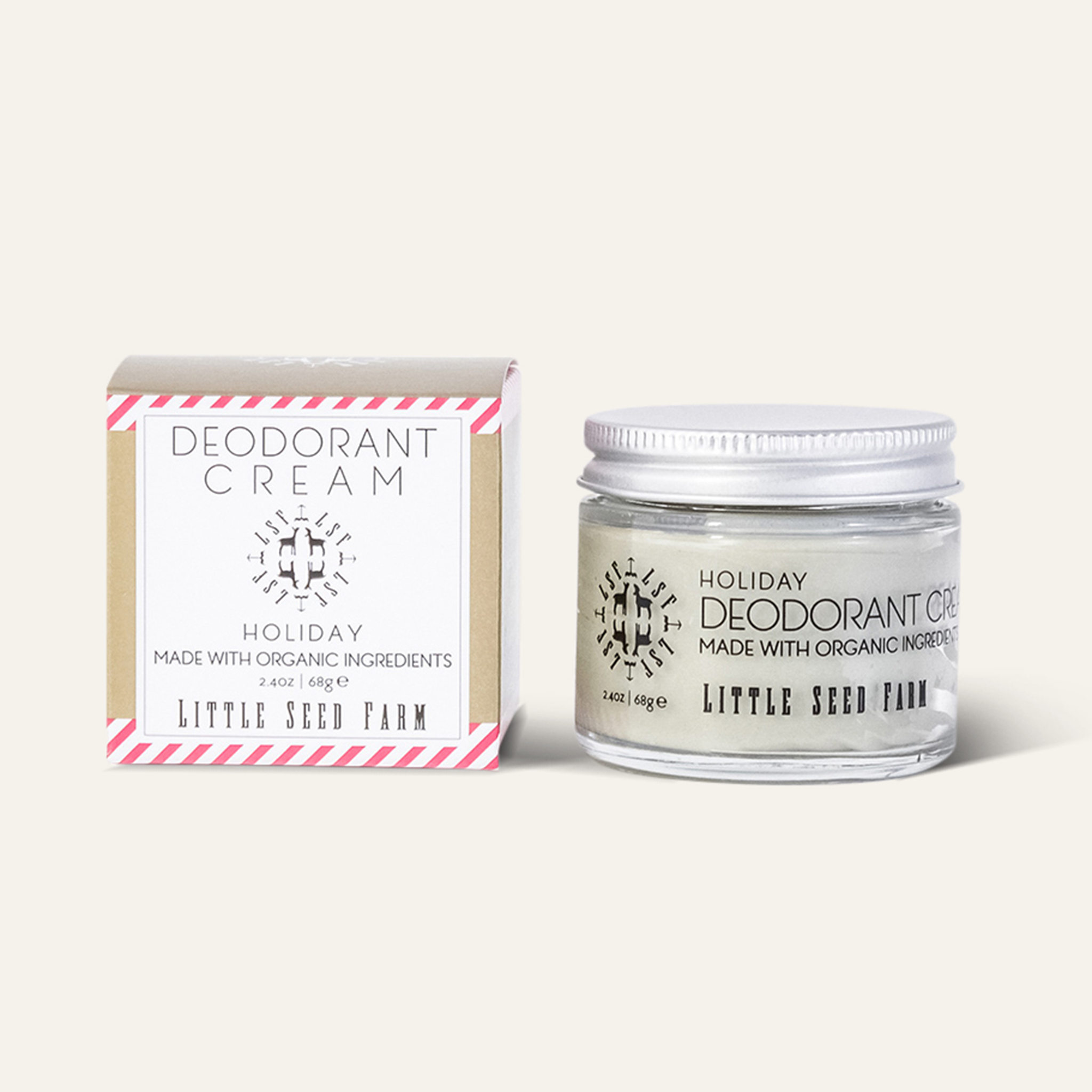 Close-up of Holiday Deodorant Cream texture inside jar, creamy light tone with fine granules showing activated charcoal blend