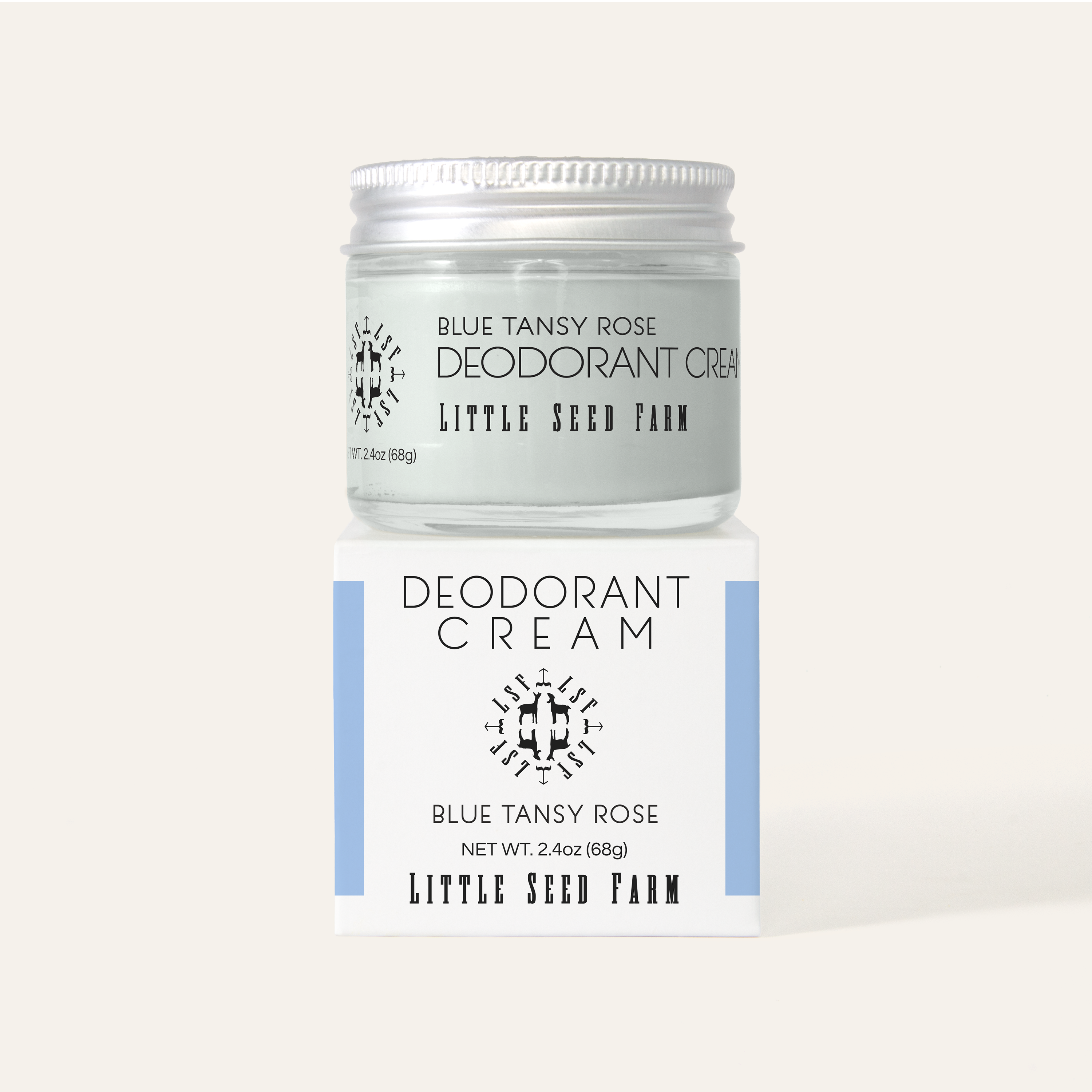 Little Seed Farm Blue Tansy Rose Deodorant Cream jar on top of its box, showing clean design and scent label