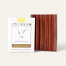 The Little Seed Farm Soap Bar + Dish Set, featuring a milk soap bar and a handmade cedar dish with vertical grooves, creates the perfect pairing for goat milk soap lovers.
