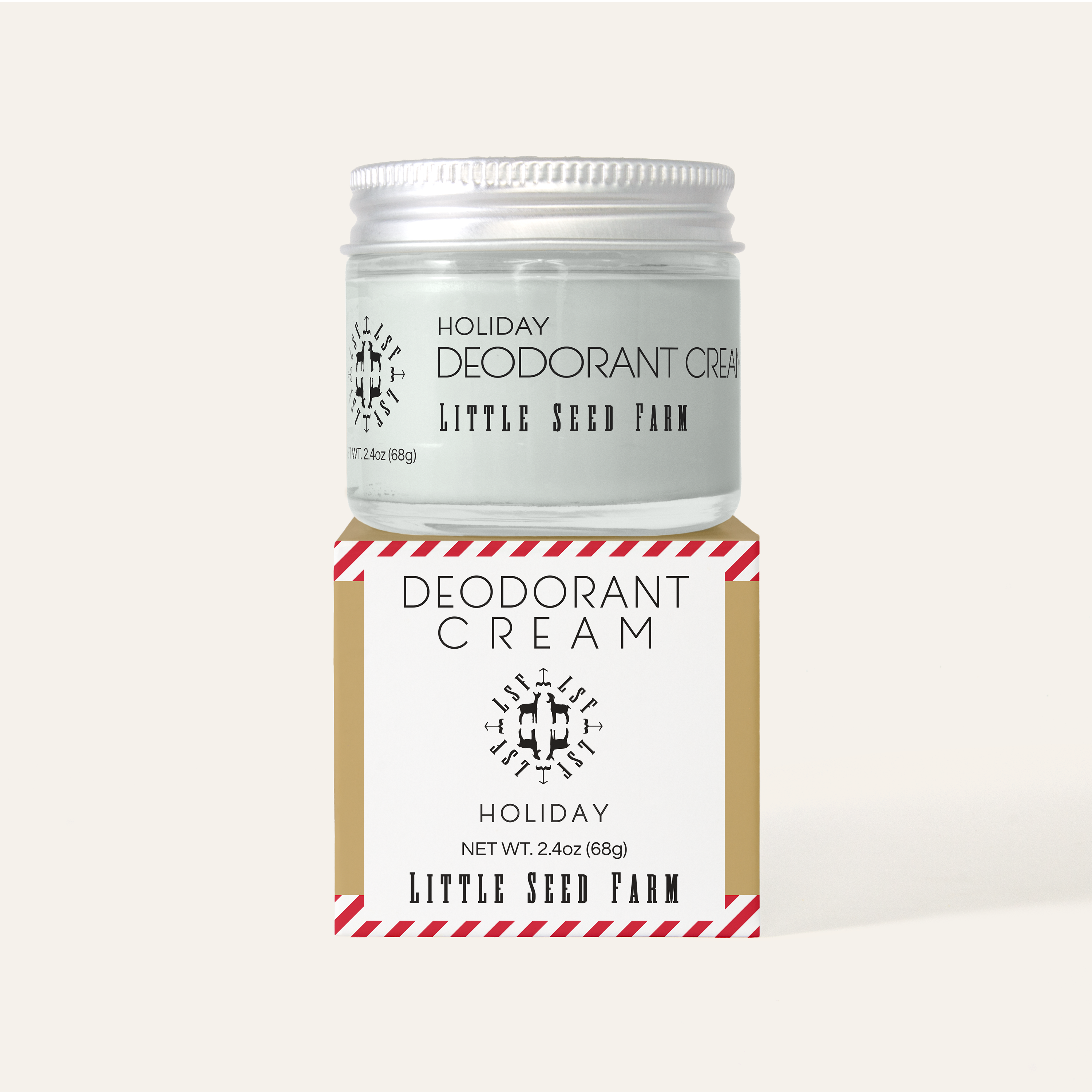 Holiday Deodorant Cream jar by Little Seed Farm on top of its festive kraft box, showing peppermint stripe accent and holiday branding. Natural and organic, aluminum free deodorant.