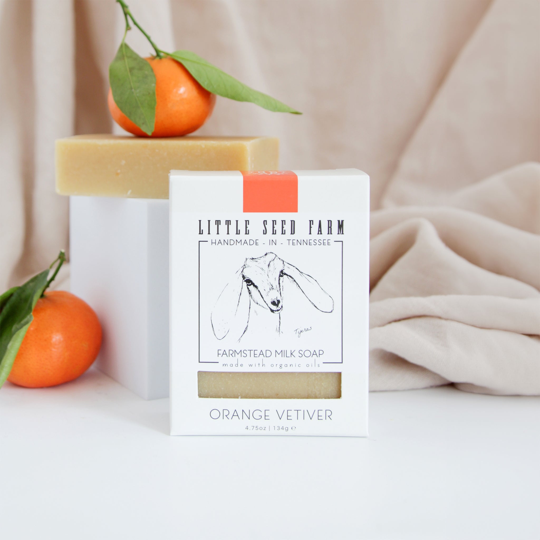 Little Seed Farm Orange Vetiver goat’s milk soap bar made with organic goat’s milk, olive and coconut oils, and essential oils of sweet orange and vetiver for calming, moisturizing, and rejuvenating skin.