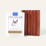 A Little Seed Farm Soap Bar + Dish Set, featuring a nourishing goat milk soap and a handmade cedar soap dish with grooved slots, is displayed against a light background.
