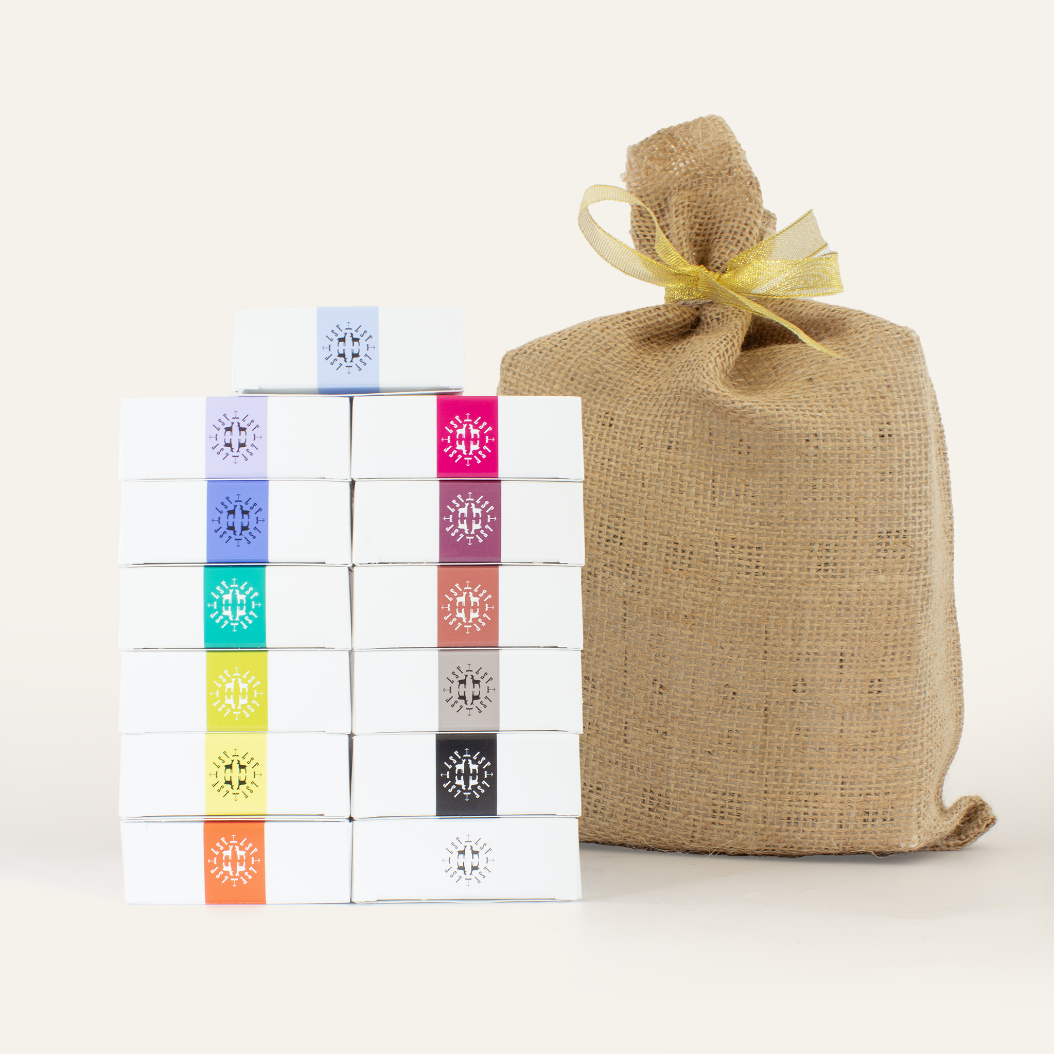 The Soap Rainbow hand-tied burlap bundle featuring all 12 scents of Little Seed Farm’s organic goat milk soap—each bar made with grass‑fed goat’s milk, organic coconut and olive oils, and essential oils—for healing and moisturizing everyday use