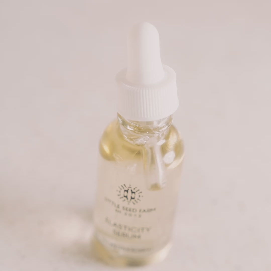 Little Seed Farm Hazelnut Rosemary Elasticity Serum formulated with virgin hazelnut oil and an organic essential oil blend to moisturize, tone, enhance skin elasticity, reduce fine lines and hyperpigmentation, and leave a glowing finish