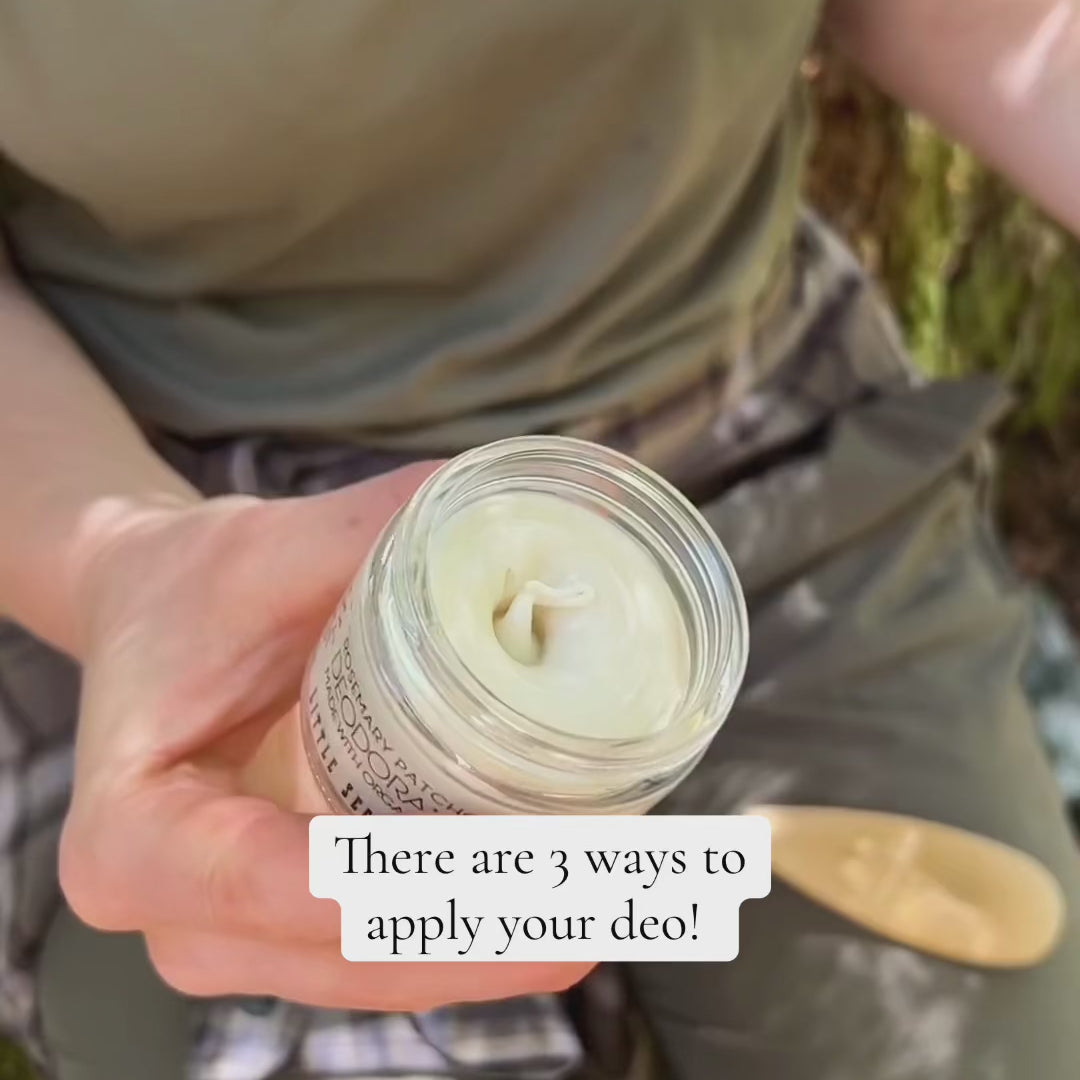 Person holding jar and applying unscented deodorant cream onto skin, demonstrating how to use it