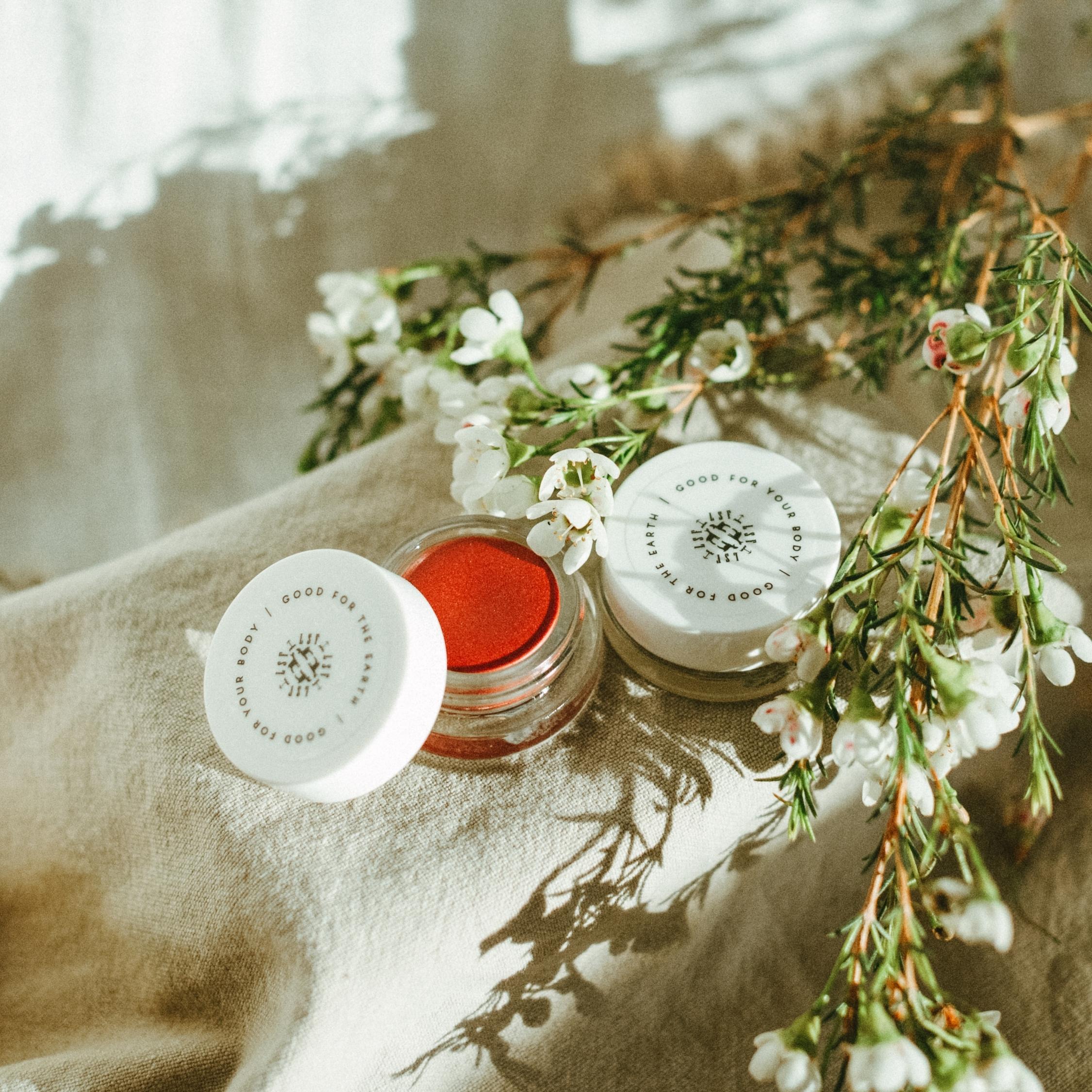 Little Seed Farm Rose Lip Tint in a deep, warm rose shade with a hint of berry, nourishing lips, cheeks, and eyelids with organic camellia oil, shea butter, and vitamin E for a natural flush of color.