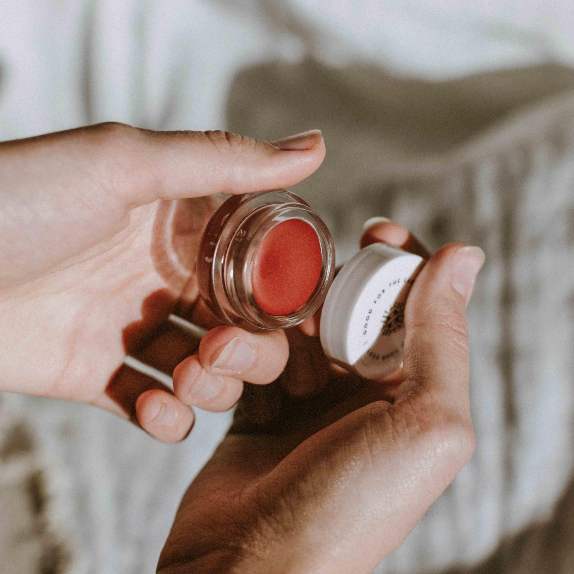 Little Seed Farm Rose Lip Tint in a deep, warm rose shade with a hint of berry, nourishing lips, cheeks, and eyelids with organic camellia oil, shea butter, and vitamin E for a natural flush of color.