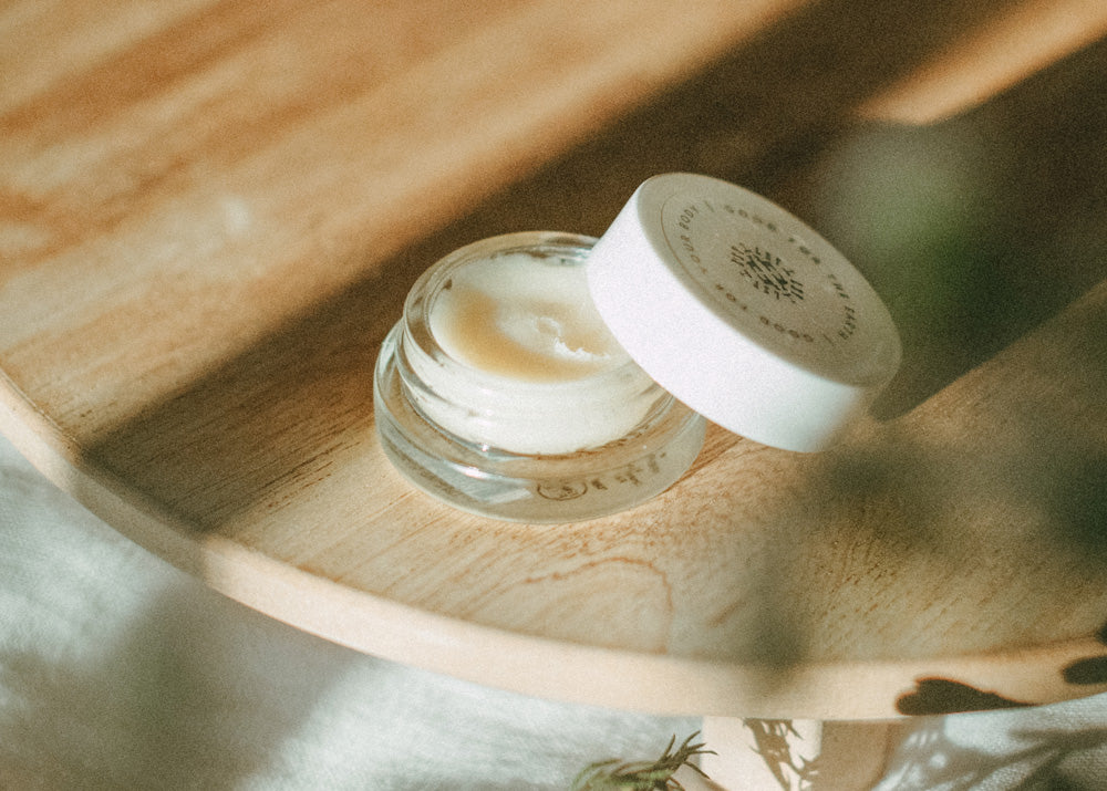 Little Seed Farm Honey Lip Treatment in a glass jar, featuring ultra-hydrating raw honey from the farm, plumping organic camellia oil, and soothing shea butter to nourish and exfoliate lips naturally.