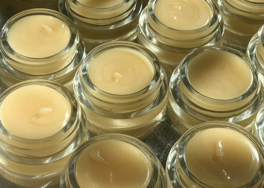 Little Seed Farm Honey Lip Treatment in a glass jar, featuring ultra-hydrating raw honey from the farm, plumping organic camellia oil, and soothing shea butter to nourish and exfoliate lips naturally.