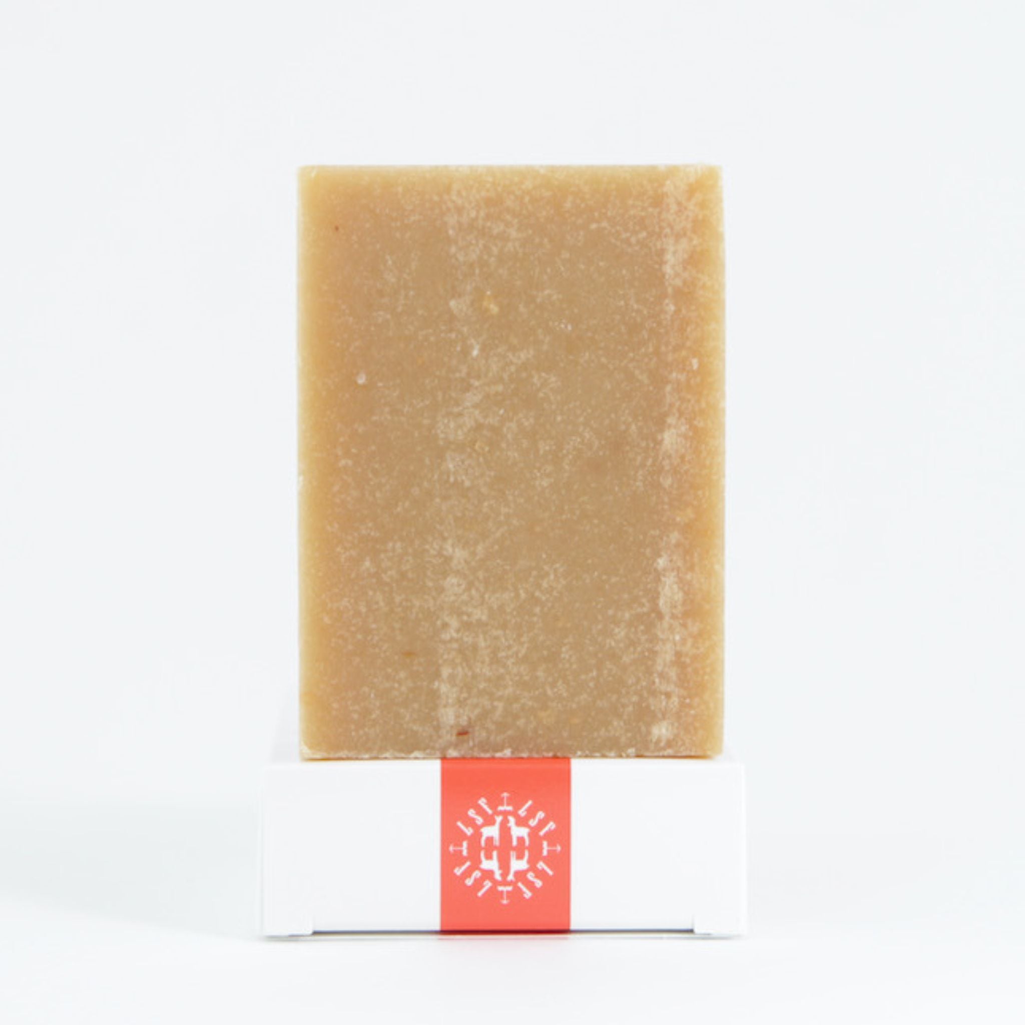 Eco‑friendly, biodegradable packaging of the Orange Vetiver goat’s milk soap emphasizing sustainable, plastic‑free materials and regenerative farm‑sourced ingredients.