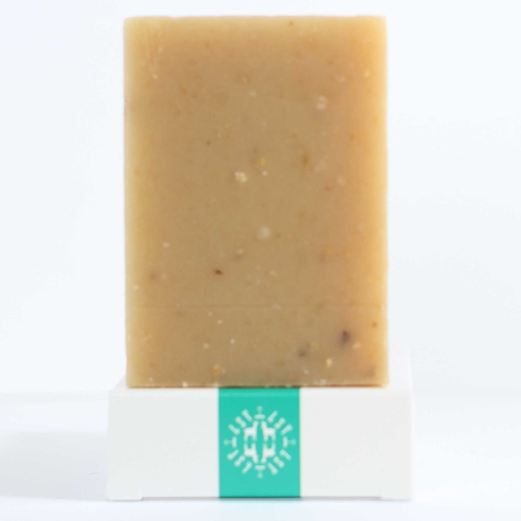 Eco‑friendly packaging of the Rosemary Mint Scrub Bar emphasizing sustainable, plastic‑free materials and cruelty‑free, regenerative farm‑produced goat’s milk soap.