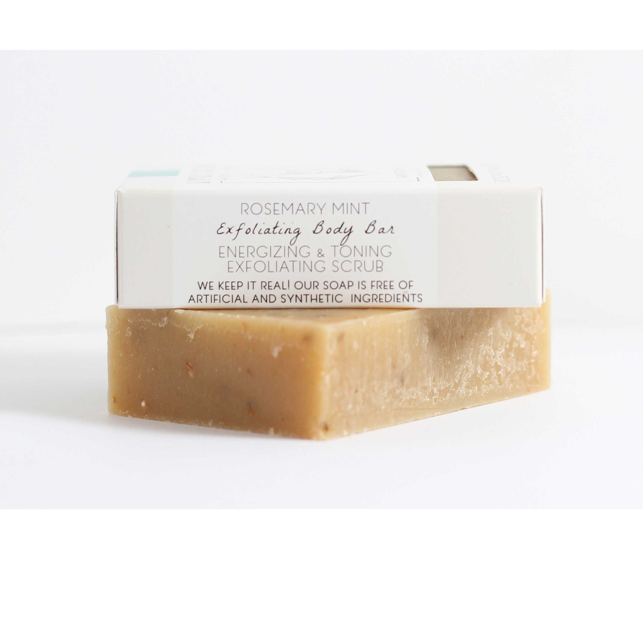 Eco‑friendly packaging of the Rosemary Mint Scrub Bar emphasizing sustainable, plastic‑free materials and cruelty‑free, regenerative farm‑produced goat’s milk soap.