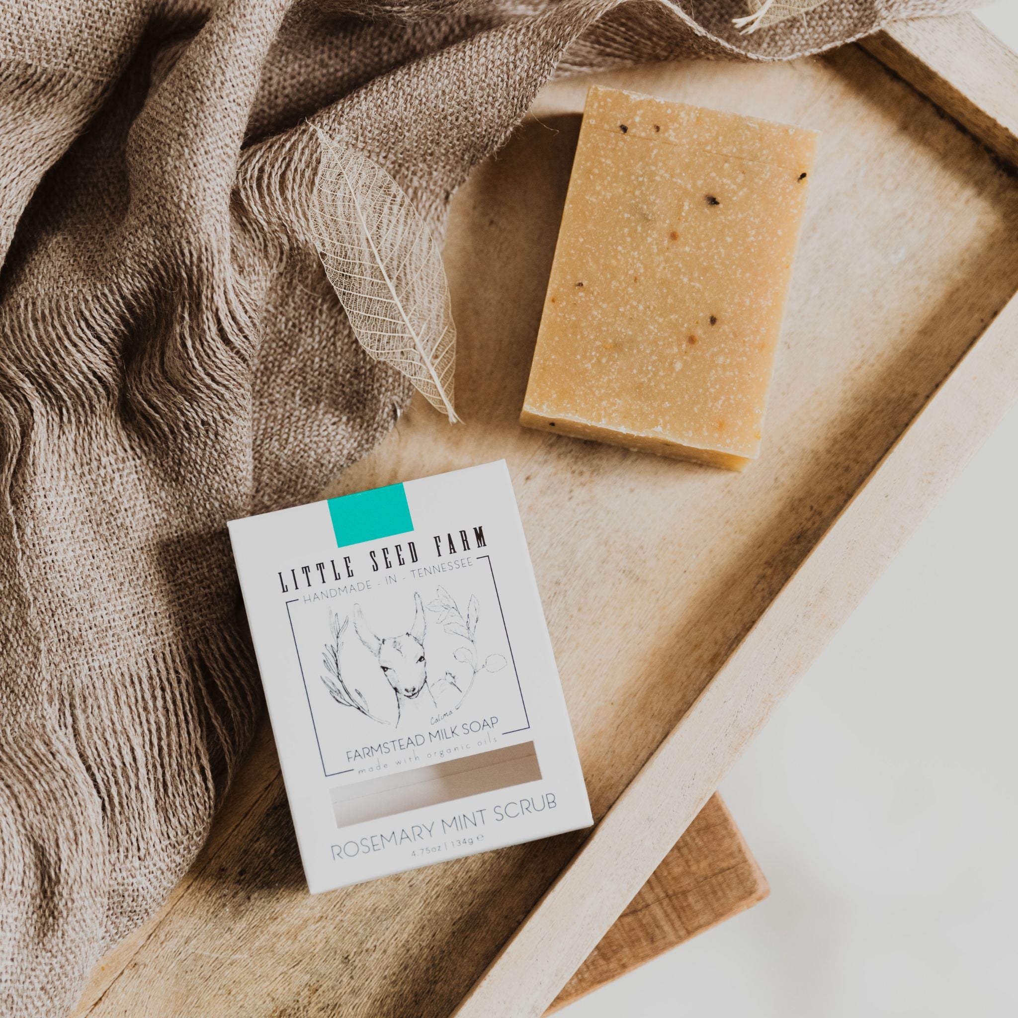 Little Seed Farm Rosemary Mint Scrub Bar soap made with organic goat’s milk, cornmeal, rosemary and spearmint essential oils and leaves for gentle exfoliation, soothing hydration, and an energizing minty‑herbal scent.