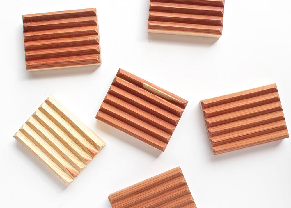 Sustainably crafted cedar soap dish designed to elevate and extend the life of bar soap by allowing proper drainage and airflow.