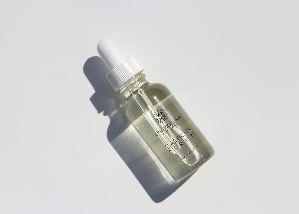 Elasticity Serum by Little Seed Farm made with virgin hazelnut oil, rosemary, spearmint, geranium, lavender and vitamin E to tone, moisturize, and stimulate collagen for firmer, glowing skin
