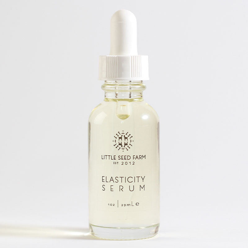 Little Seed Farm Hazelnut Rosemary Elasticity Serum formulated with virgin hazelnut oil and an organic essential oil blend to moisturize, tone, enhance skin elasticity, reduce fine lines and hyperpigmentation, and leave a glowing finish