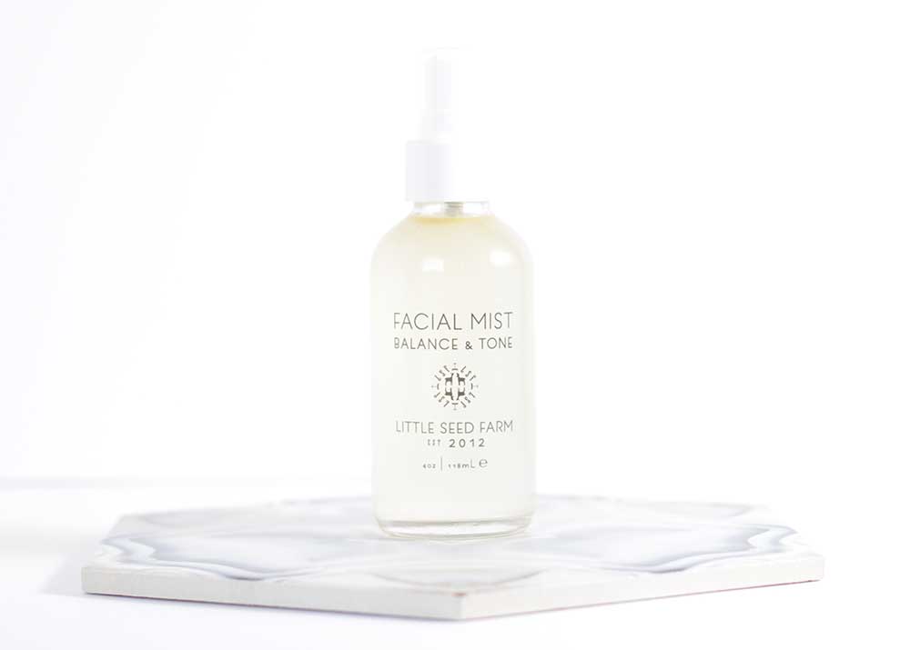 Little Seed Farm Toning Facial Mist with organic aloe and witch hazel, featuring calming blue German chamomile and marshmallow root extract to soothe, balance pH, and refine pores for all skin types.