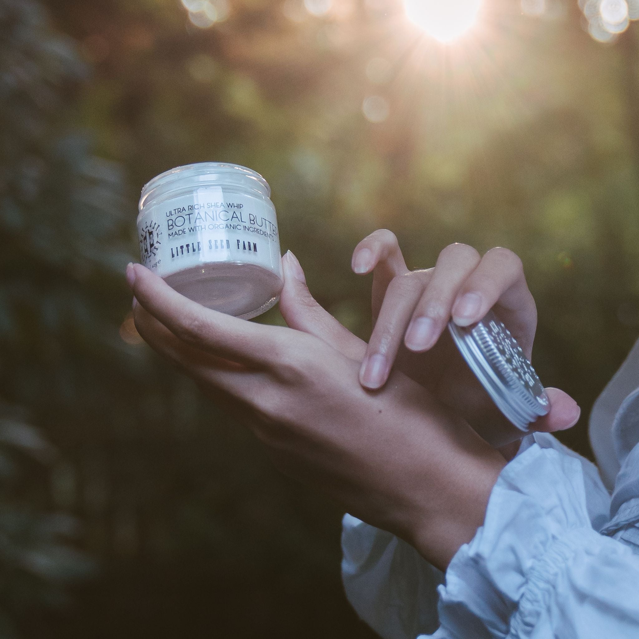 Healing Body Butter botanical shea butter in a 1.5 oz glass jar with just five organic ingredients—including shea butter, sweet almond oil, grapefruit peel oil, vanilla extract, and vitamin E—for deep hydration and soothing of dry skin.