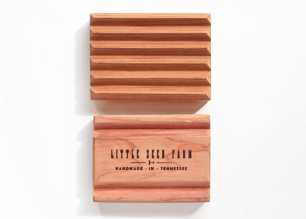 Sustainably crafted cedar soap dish designed to elevate and extend the life of bar soap by allowing proper drainage and airflow.