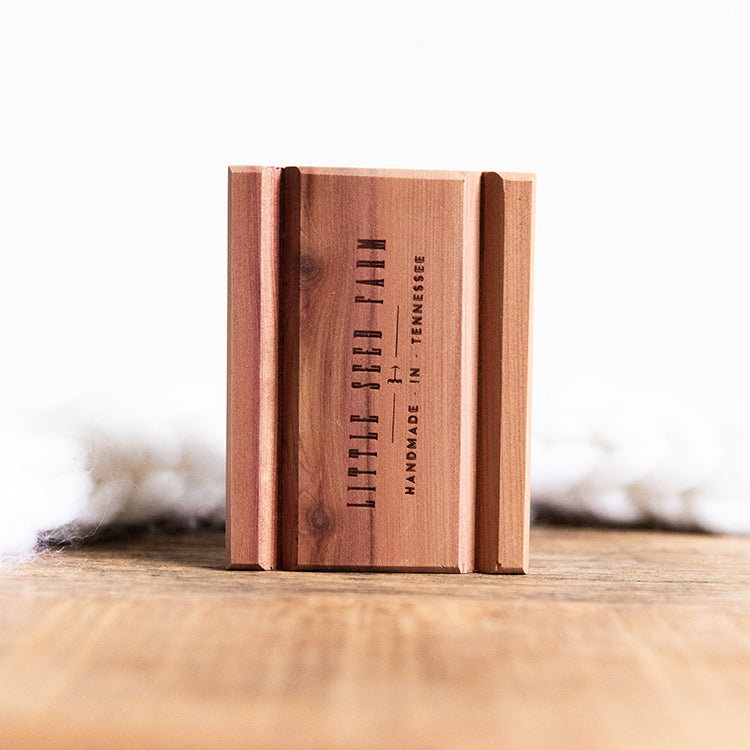 Sustainably crafted cedar soap dish designed to elevate and extend the life of bar soap by allowing proper drainage and airflow.