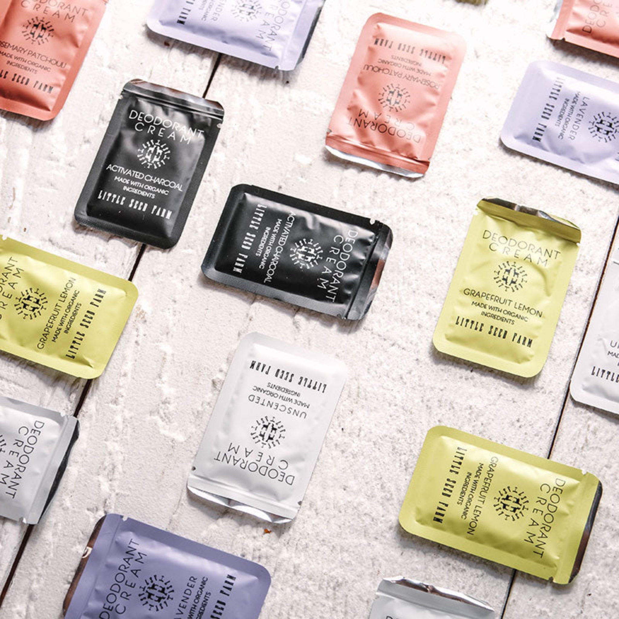 Editorial-style image of Little Seed Farm’s natural deodorant cream samples in a flatlay, showcasing sustainable, organic, aluminum-free formulas designed for clean, effective underarm care.