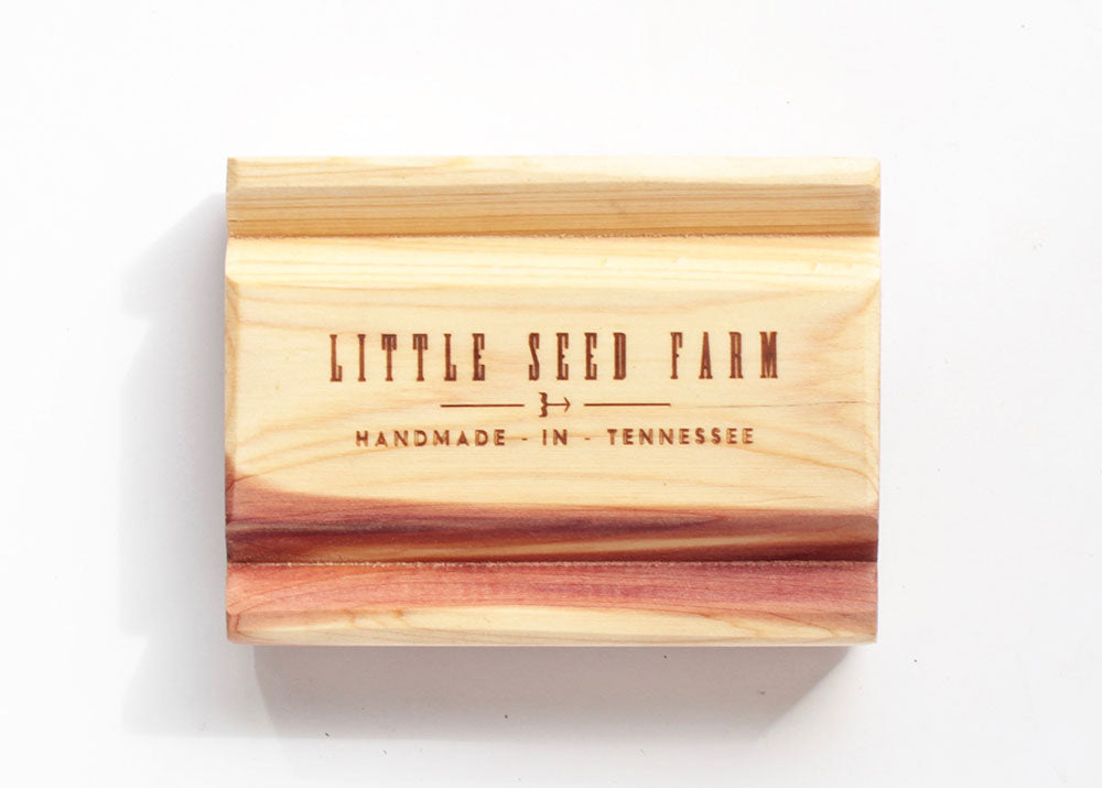 Sustainably crafted cedar soap dish designed to elevate and extend the life of bar soap by allowing proper drainage and airflow.
