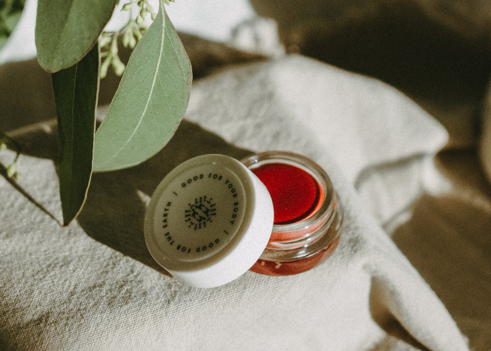 Little Seed Farm Rose Lip Tint in a deep, warm rose shade with a hint of berry, nourishing lips, cheeks, and eyelids with organic camellia oil, shea butter, and vitamin E for a natural flush of color.