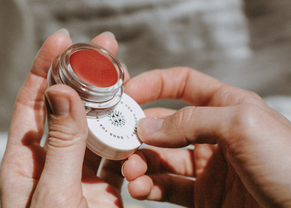 Little Seed Farm Rose Lip Tint in a deep, warm rose shade with a hint of berry, nourishing lips, cheeks, and eyelids with organic camellia oil, shea butter, and vitamin E for a natural flush of color.