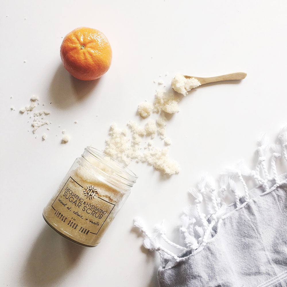 Organic Sugar Scrub made with fair-trade sugar, coconut and sweet almond oils, and uplifting citrus-vanilla essential oils for gentle exfoliation that softens, hydrates, and lifts mood.