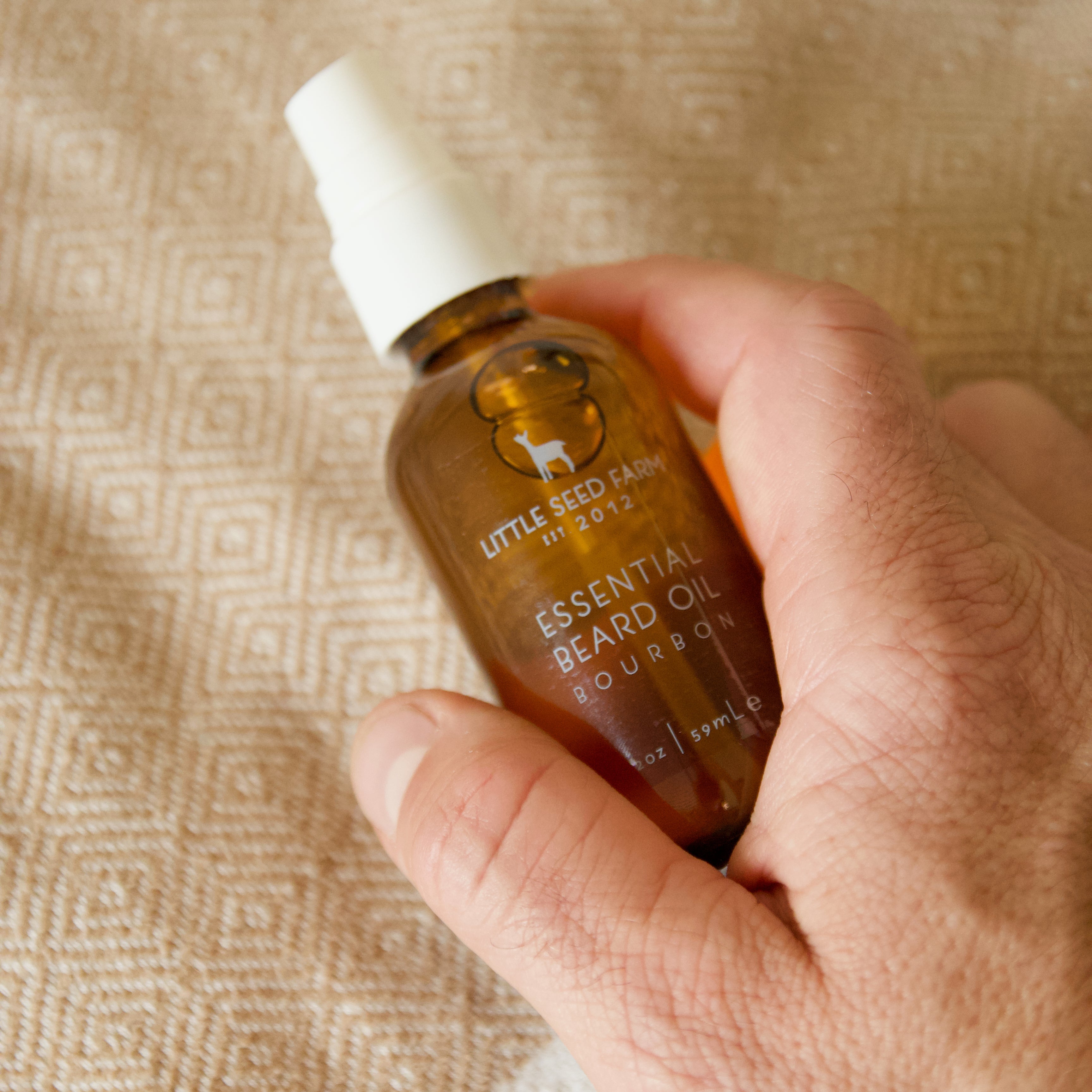 hydrating organic beard oil in brown glass bottle